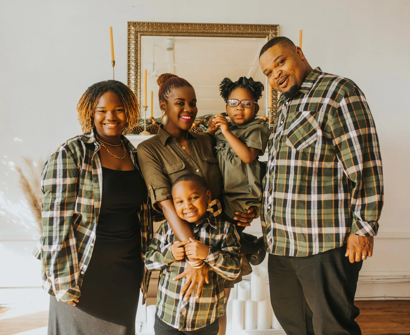 Cupcake with her mom, dad, sister Karli, and brother Jaxson in matching plaid