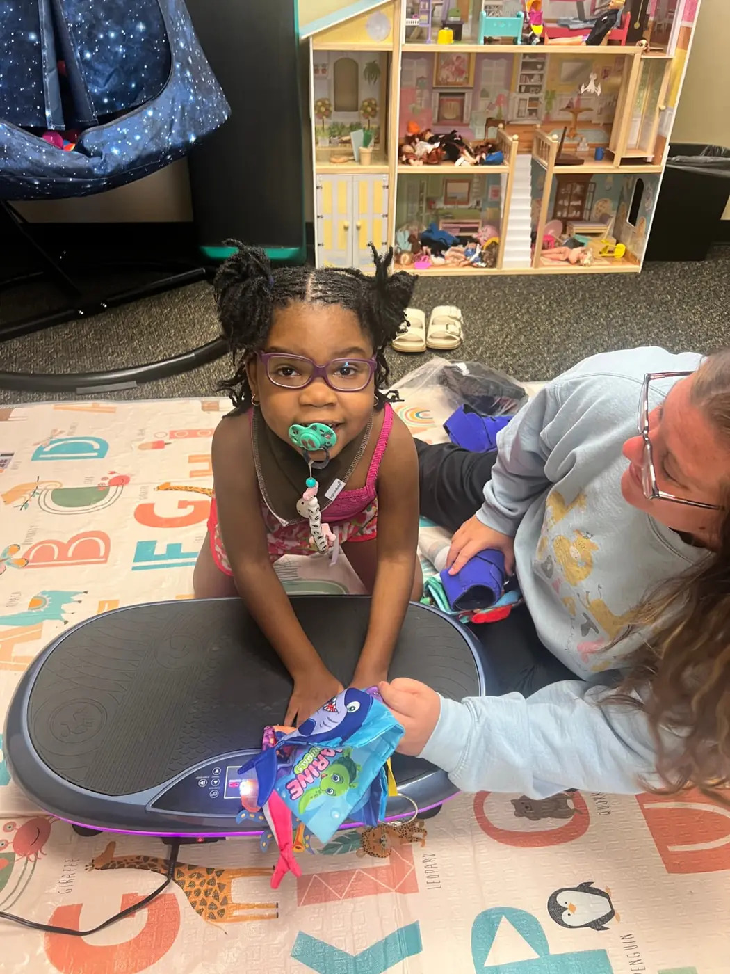 Cupcake at home during therapy with her equipment